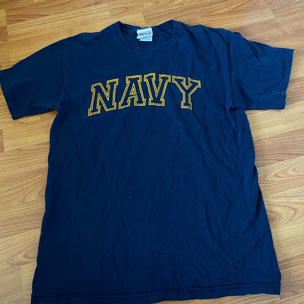 Navy blue with yellow text NAVY shirt.